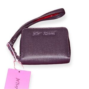 Betsey Johnson plum XOSKULLY zip up compact wallet